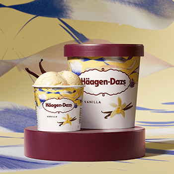 haagen dazs vanila ice cream pint & mini cup arranged on a patterned cream & blue background